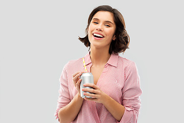 Image showing woman drinking soda from can with paper straw