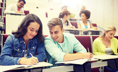 Image showing group of students with notebooks at lecture hall