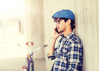 Image showing man with smartphone and fixed gear bike on street