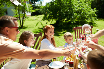 Image showing happy family having dinner or summer garden party