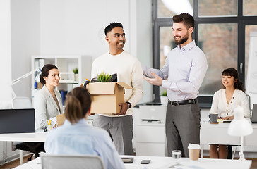 Image showing new male employee meeting colleagues at office