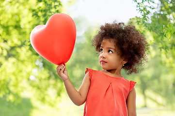 Image showing african american girl with heart shaped balloon