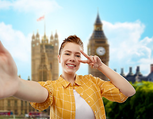 Image showing redhead teenage girl taking selfie in london