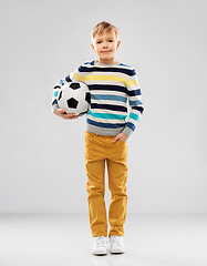 Image showing boy in striped pullover with soccer ball