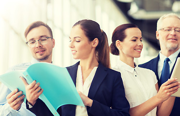 Image showing business team with folders meeting at office