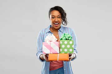 Image showing happy african american woman with birthday gifts