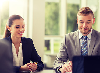 Image showing smiling business people meeting in office