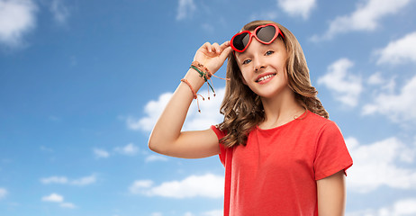 Image showing happy teenage girl in red heart shaped sunglasses