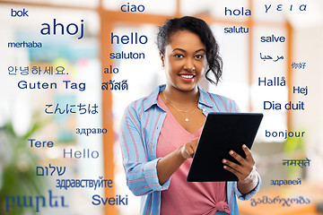 Image showing happy african american woman using tablet pc