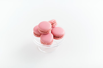 Image showing pink macarons on glass confectionery stand