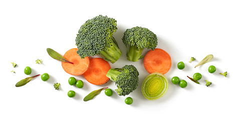 Image showing fresh broccoli, carrot and green peas isolated on white backgrou