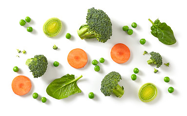 Image showing fresh broccoli, carrot and green peas isolated on white backgrou