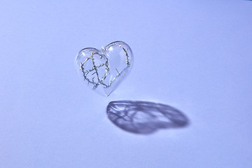 Image showing Floating clear heart with twisted wire inside.