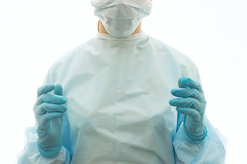 Image showing Surgeon in sterile gown, surgical mask and gloves is ready to work