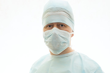 Image showing Portrait of calm surgeon in sterile gown and surgical mask