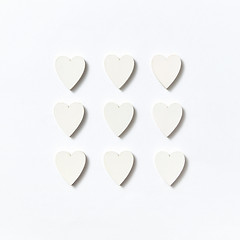 Image showing Valentine\'s square pattern from paper hearts. Flat lay.