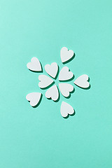 Image showing Valentine\'s flowers pattern made from small hearts with shadows.