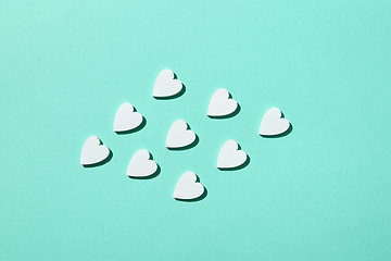 Image showing Handmade paper hearts pattern with hard shadows.