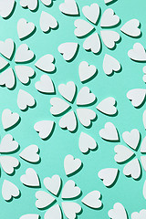 Image showing Flowering pattern made from plaster hearts with shadows.