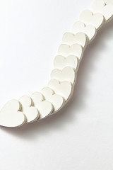 Image showing Creative chain from plaster Valentine\'s heartw with soft shadows.