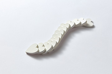 Image showing Curve chain from plaster hearts in the shape of snake.