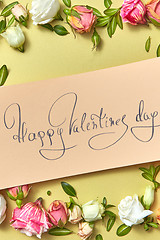 Image showing Greeting Valentine\'s card with natural flowers frame.