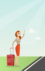 Image showing Young caucasian woman with suitcase hitchhiking.