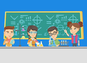 Image showing Caucasian kids working at chemistry class.