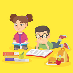 Image showing Two caucasian children doing homework together.