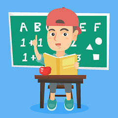 Image showing Pupil sitting at the desk and pointing finger up.