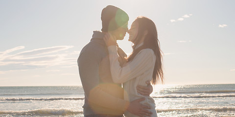 Image showing Couple having fun on beautiful autumn day at beach