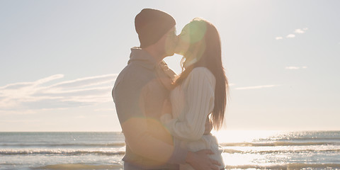 Image showing Couple having fun on beautiful autumn day at beach