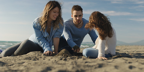 Image showing Young family enjoying vecation during autumn