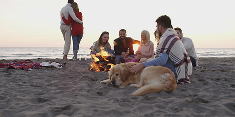 Image showing Friends Relaxing At Bonfire Beach Party