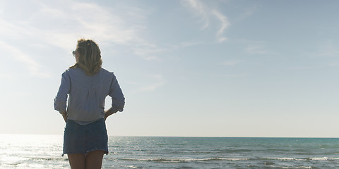 Image showing Young woman enjoying the warm autumn day