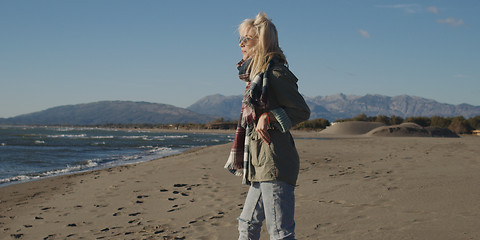 Image showing Young woman enjoying the warm autumn day