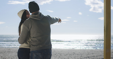 Image showing Couple having fun on beautiful autumn day at beach