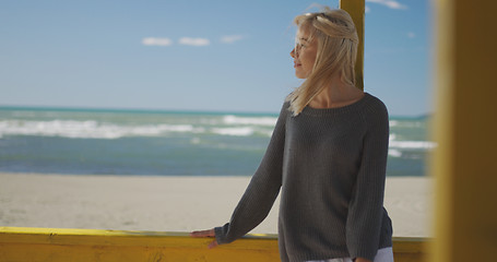 Image showing Young woman enjoying the warm autumn day