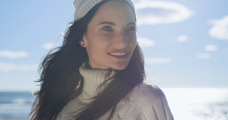 Image showing Girl In Autumn Clothes Smiling on beach