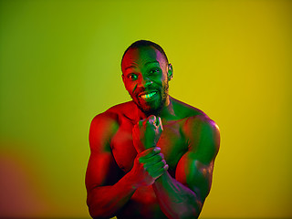 Image showing Close up portrait of a young naked african man looking at camera indoors