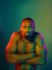 Image showing Close up portrait of a young naked african man looking at camera indoors