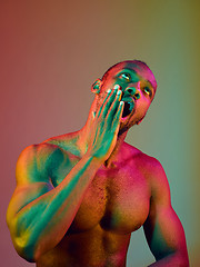 Image showing Close up portrait of a young naked african man looking at camera indoors