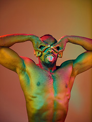 Image showing Close up portrait of a young naked african man looking at camera indoors