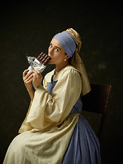 Image showing Medieval Woman in Historical Costume Wearing Corset Dress and Bonnet.