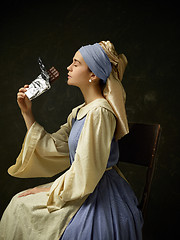 Image showing Medieval Woman in Historical Costume Wearing Corset Dress and Bonnet.