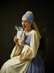 Image showing Medieval Woman in Historical Costume Wearing Corset Dress and Bonnet.