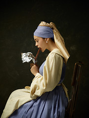 Image showing Medieval Woman in Historical Costume Wearing Corset Dress and Bonnet.