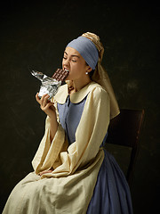 Image showing Medieval Woman in Historical Costume Wearing Corset Dress and Bonnet.