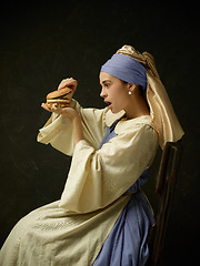 Image showing Medieval Woman in Historical Costume Wearing Corset Dress and Bonnet.