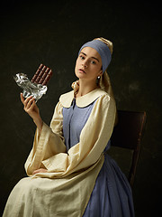 Image showing Medieval Woman in Historical Costume Wearing Corset Dress and Bonnet.